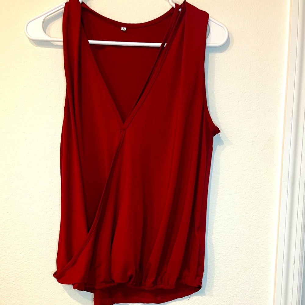 Cute red top perfect for work or jeans